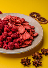 Dried sublimated slices of strawberry and raspberry as an ingredient for desserts. Dried strawberry