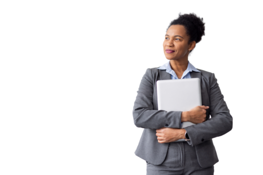 Professional businesswoman wearing gray suit, standing confidently with laptop, looking upward, displaying corporate success - Powered by Adobe