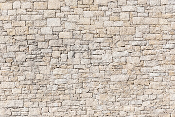 Obraz premium Granite Stone wall background texture. Dry masonry wall