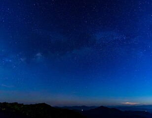 Starry night over mountains