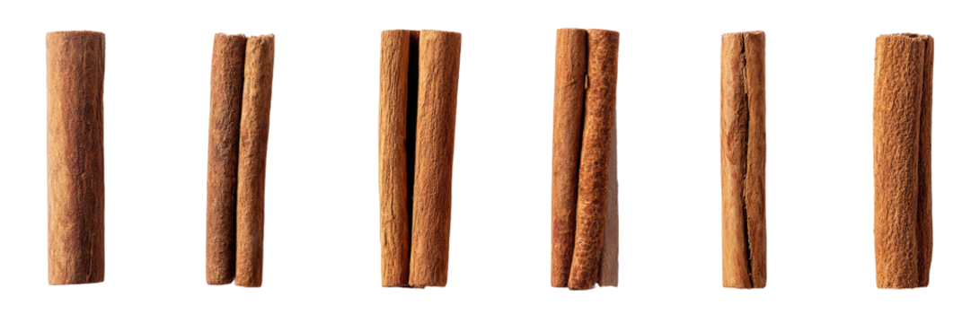 Five cinnamon sticks arranged vertically against a black background