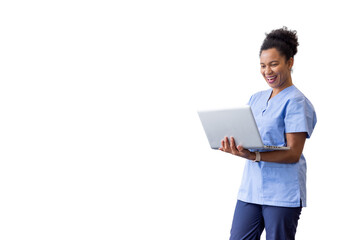 Medical professional typing on laptop, wearing scrubs, representing digital healthcare innovation...