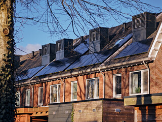 Modern row houses with integrated heat pumps on the roof in Assen