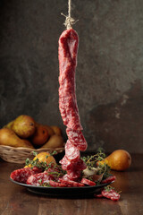 Dry-cured sausages with thyme and pears.