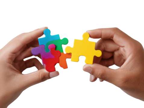 Two hands hold colorful puzzle pieces, nearly joined
