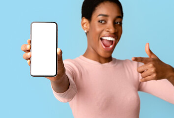 Great App. Excited Black Female Pointing At Smartphone With Big Blank White Screen, Surprised...