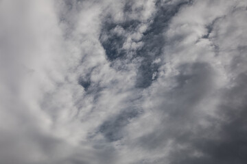 Dramatic sky with illuminated clouds and deep blue background  
