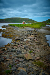 Old fishing shack at low tide. Saint Lunaire-Griquet, Newfoundland, Canada.