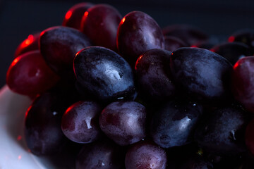 Dark grapes close-up for rustic fruit food background