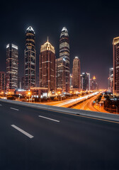 Fototapeta premium Panoramic skyline and modern commercial buildings with empty road Asphalt road and cityscape at night