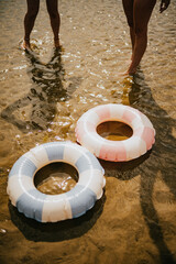 Two inflatable pool floats are in the water