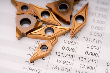 Precision cutting tools arranged on a technical data sheet showcasing measurements and...