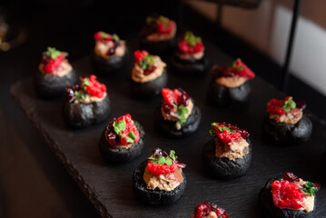 Gourmet appetizers with black buns