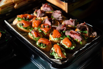 Gourmet appetizers with salmon and beef