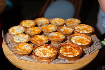 Assorted savory quiches on table