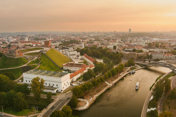 Fototapeta premium Scenic aerial view of Vilnius Old Town and Neris river at nightfall. Sunset landscape.