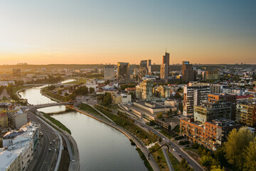 Fototapeta premium Scenic aerial view of Vilnius Old Town and Neris river at nightfall. Sunset landscape.