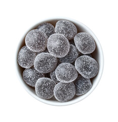 Round, translucent, dark-gray, hard candies in a small, white bowl