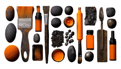 Orange art supplies and dark stones arranged in a grid pattern on a black background