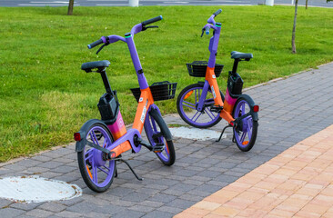 Two rental, electric bicycles. City