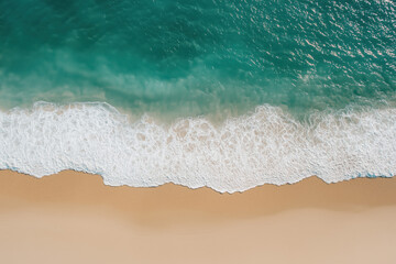 Top view of beach waves hitting shoreline