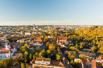Naklejka premium Beautiful Vilnius city panorama in autumn with orange and yellow foliage. Fall city scenery in Vilnius, Lithuania
