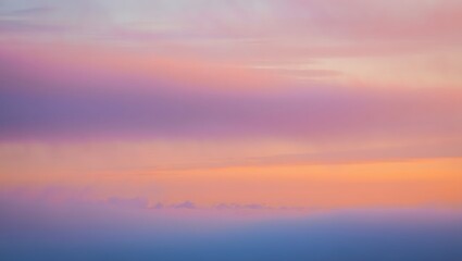 Fototapeta premium Pastel Hues of a Sunset Sky Painted with Clouds