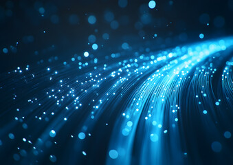 Fototapeta premium Glowing blue fiber optic strands with bokeh lights