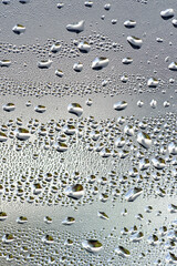 background, unusual, abstract. drops of morning dew, condensation on the glass. wet glass. water drops close-up. beautiful background for text. Spray cool condensate water on the glas