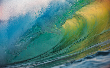 Inside curling ocean wave with sunlight reflections
Close-up view inside a curling ocean wave with golden sunlight illuminating the translucent turquoise water, creating a vivid and dynamic seascape
