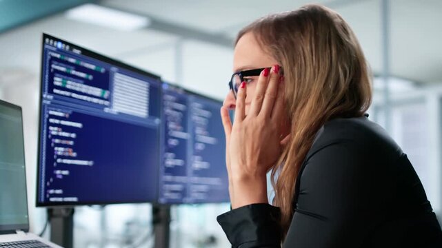Female Software Engineer Sad At Desk Working