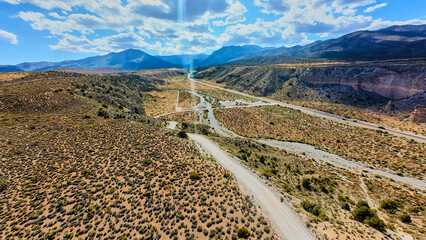 Aerial Desert Landscape With Mountain Range and Dirt Road Nevada