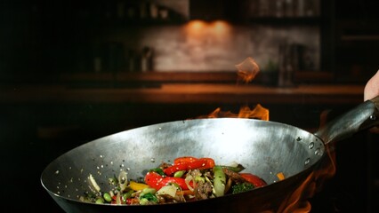 Freeze Motion of Flying Asian Wok Ingredients with Fire Flames