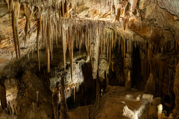 Stunning cave stalactites creating a dramatic underground scene