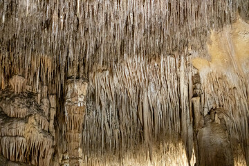 Stunning stalactite formations in majestic cave interior landscape