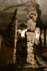 Majestic stalactites and stalagmites in ancient underground cave formation