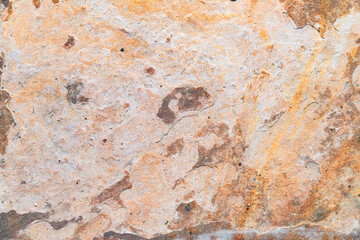 Rough stone texture with natural brown tones, grunge pattern, and cracked weathered surface.