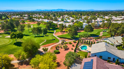 Aerial Las Vegas Golf Course Residential Homes and Distant City Skyline