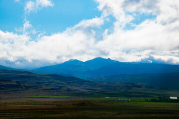 Icelandic Mountains with Clouds and Green Valleys