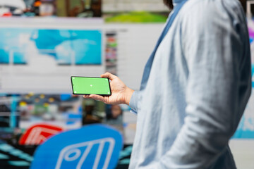 Male web user navigates phone with copy space for the world of social media platforms, leveraging creativity and mobile technology to maintain online presence and build a community. Social network.