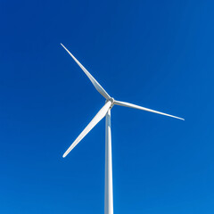Fototapeta premium Wind Turbine Under Clear Blue Sky - Wide Environmental 
