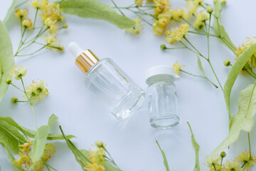 Linden extract in a small glass bottles. Herbal medicines concept.