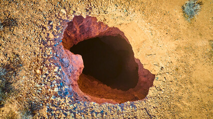 Aerial Desert Sinkhole and Rocky Terrain in Remote Nevada