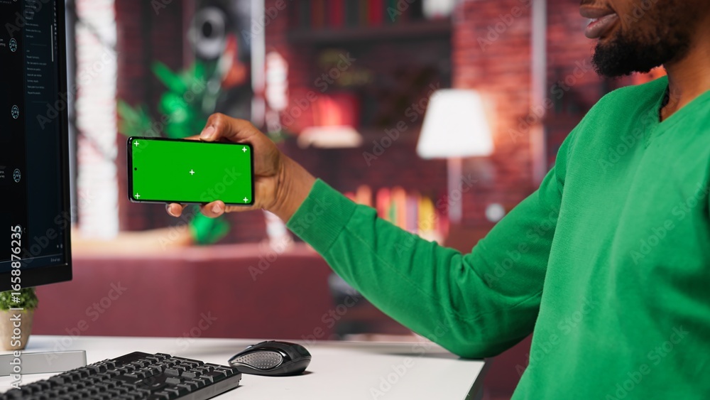 Poster african american man engaging with ai chatbot next to chroma key, using the virtual assistant with p