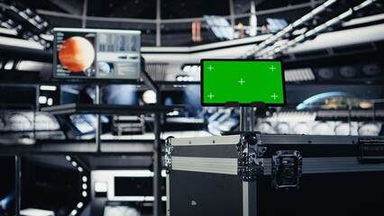 Close up of green screen tablet inside futuristic spacecraft bay used for monitoring system...