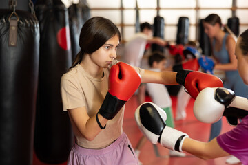 Teen girls got into fight during boxing training session. Opponent punches enemy with feet and...
