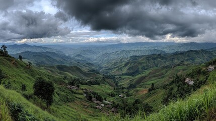 Fototapeta premium Lush valley with terraced hills under a stormy sky.