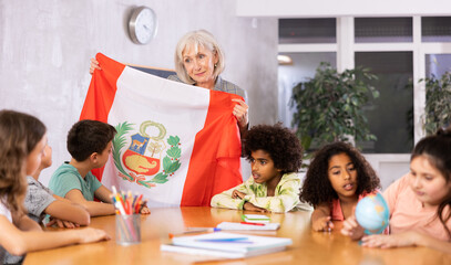 Kids learning together about peru in geography class