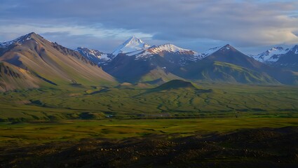 Fototapeta premium Majestic Mountain Landscape with Verdant Valley Under Dramatic Skies