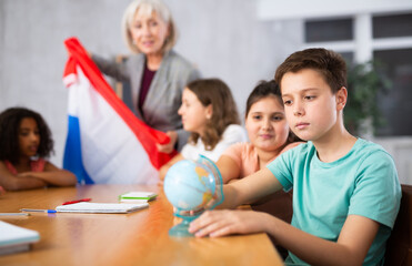 Kids learning together about netherlands in geography class